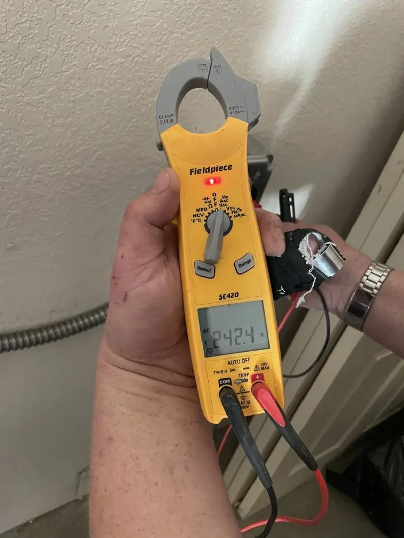 Voltage testing with clamp meter during Ceiling Fan Installation in Claymont